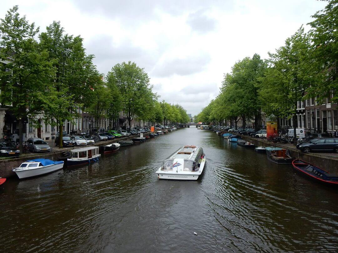 Amsterdam by train - A typical Dutch canal